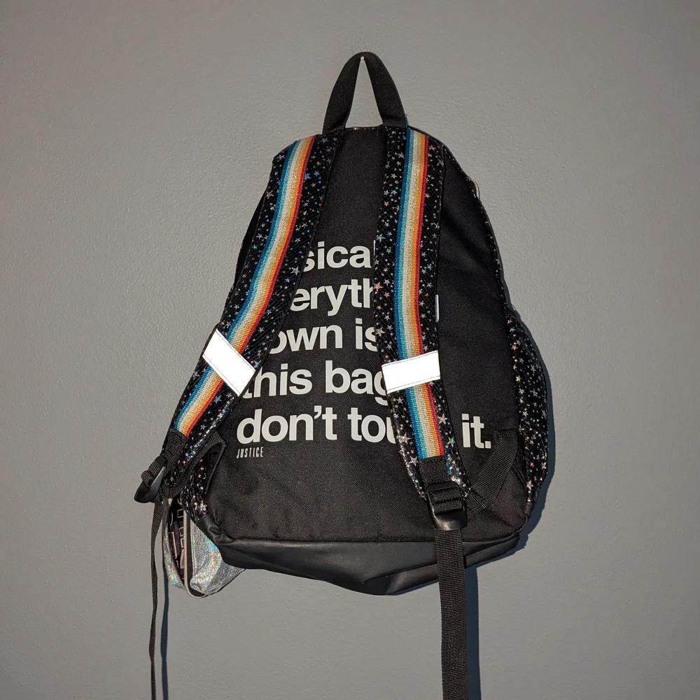 Justice Black Glitter Star Backpack with Rainbow Stripe